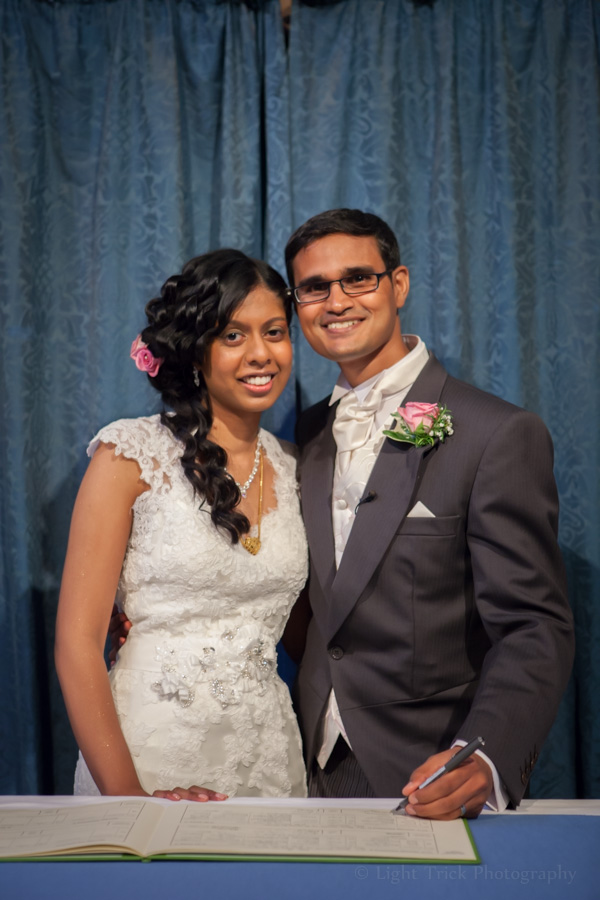 bride and groom portrait with registry book